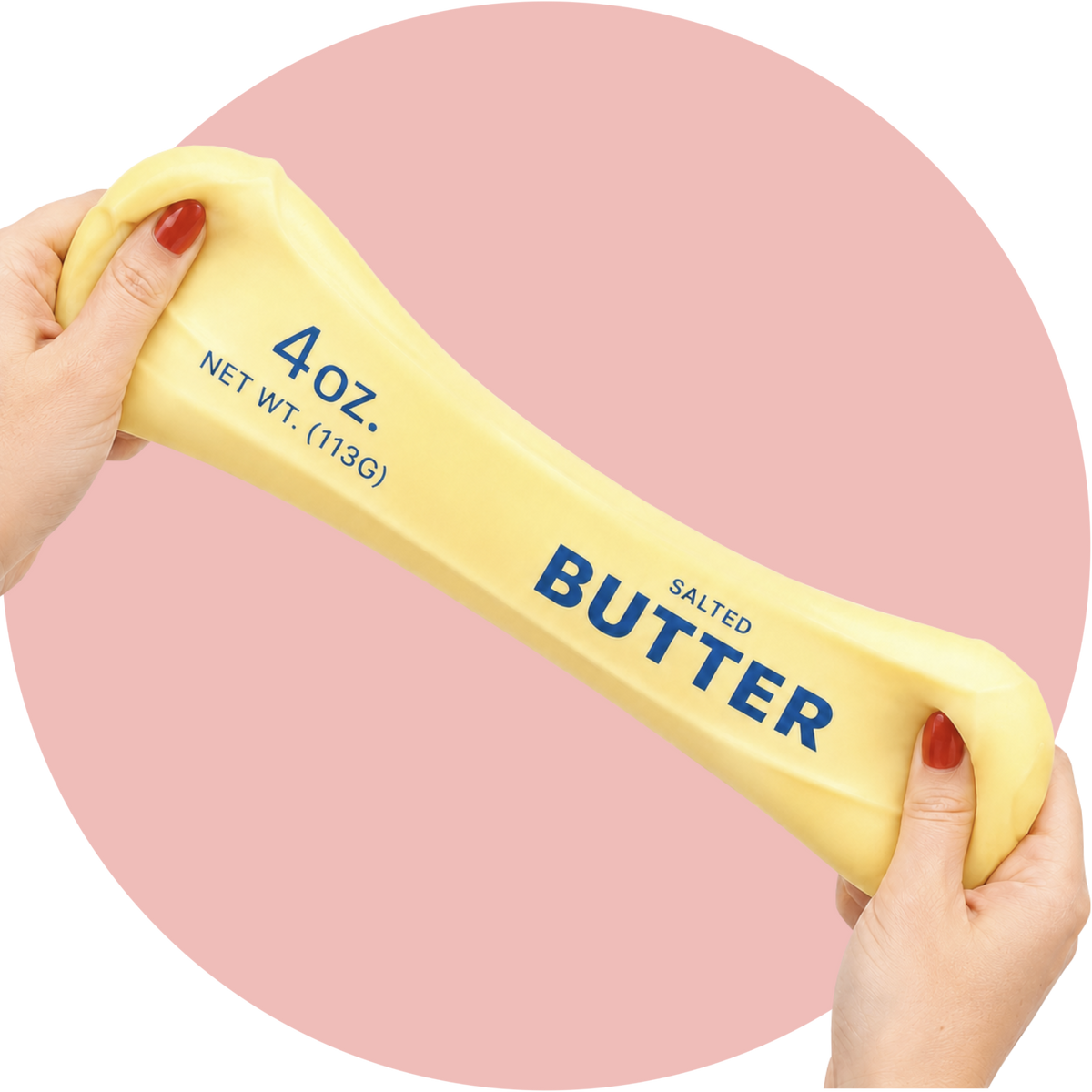 Squishy Butter Stick als virales Anti-Stress-Spielzeug in Butterform mit 4 oz.- und 113-g-Aufdruck vor rosa Hintergrund.